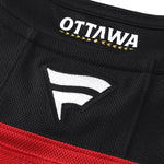 Close-up of a Ottawa Senators Alternate jersey with 'Ottawa' and a logo on a black and red background