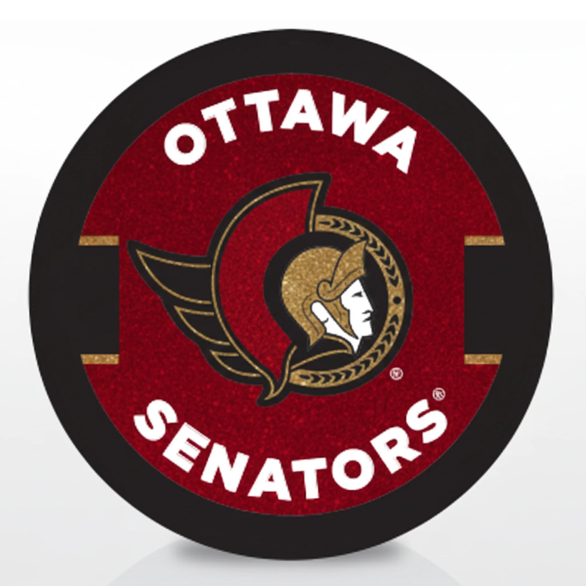 Hockey puck with a glitter Ottawa Senators logo